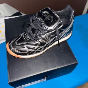 Puma Kids Black Metallic Silver Accent Sneakers with Gum Sole run small size up